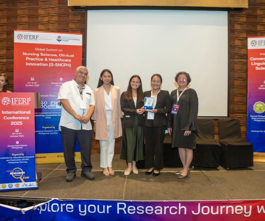 Award presentation on stage at an IFERP international conference